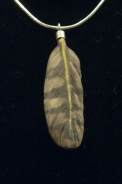 Yellow shafted flicker feather carving